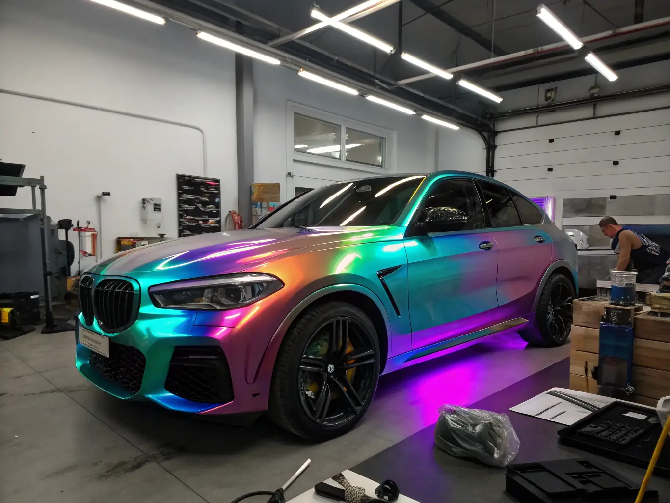A vibrant image of a fully wrapped car or motorcycle, gleaming under professional lighting, showcasing the transformative effect of Wrapgod's customization services.
